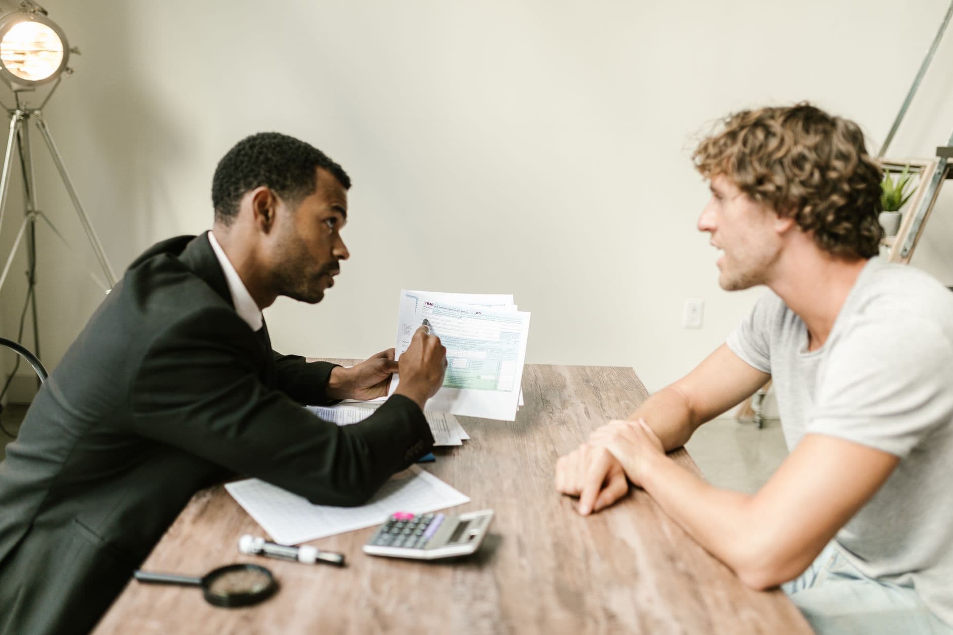 Accountant and business owner reviewing cash flow reports on a laptop