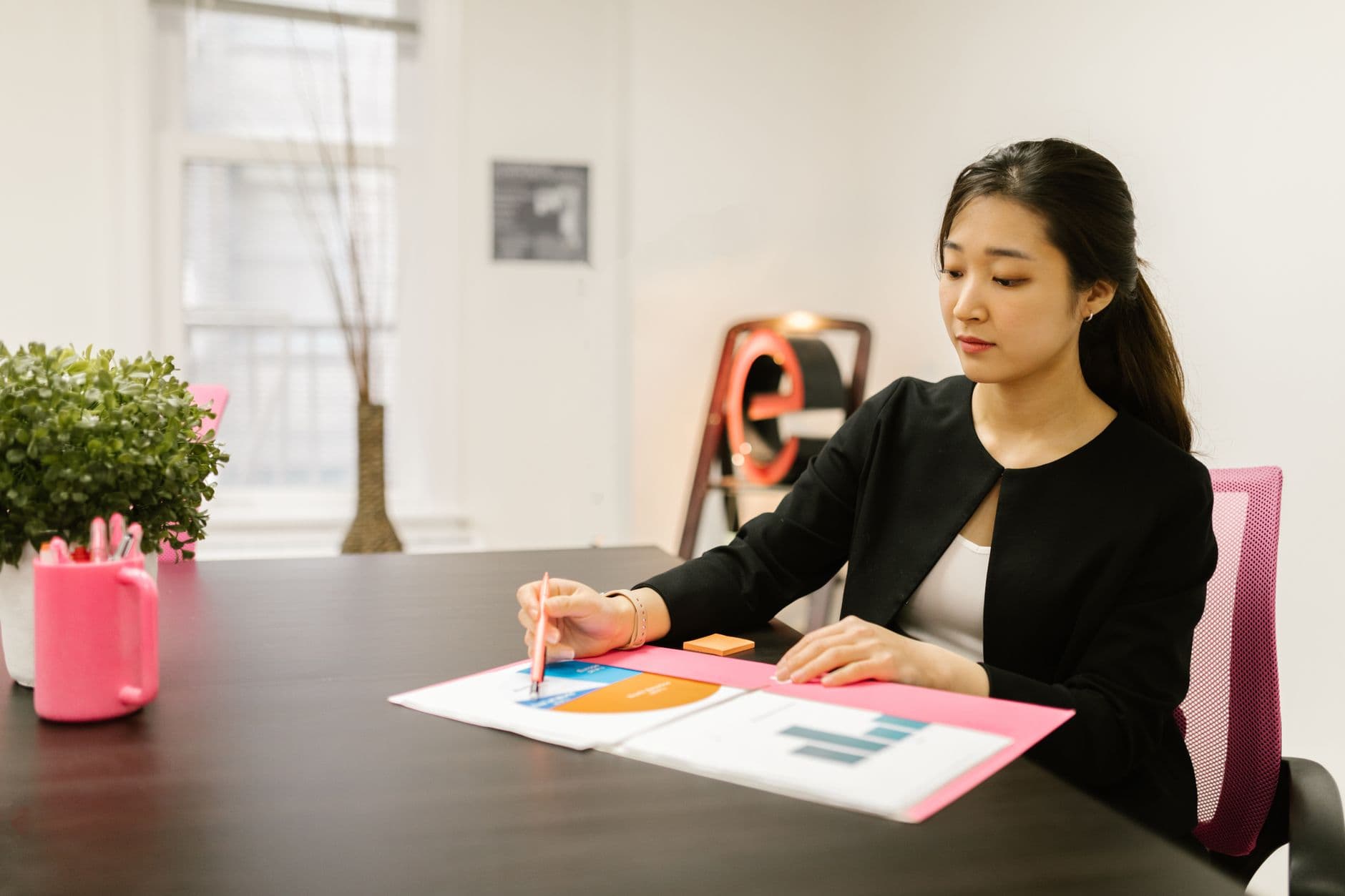 CPA reviewing financial statements with client documents on desk