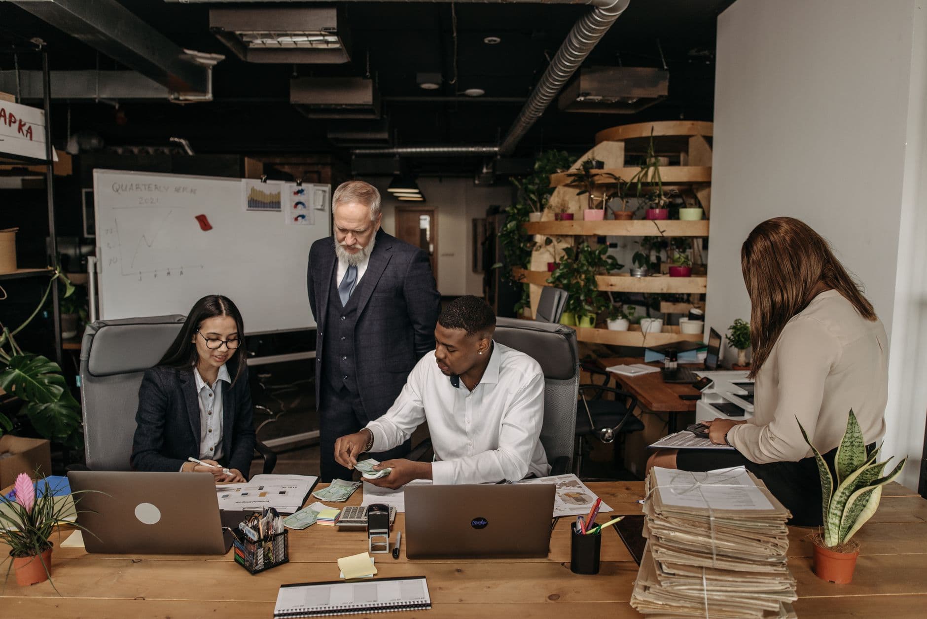 CPA advisors reviewing financial documents together in a modern office