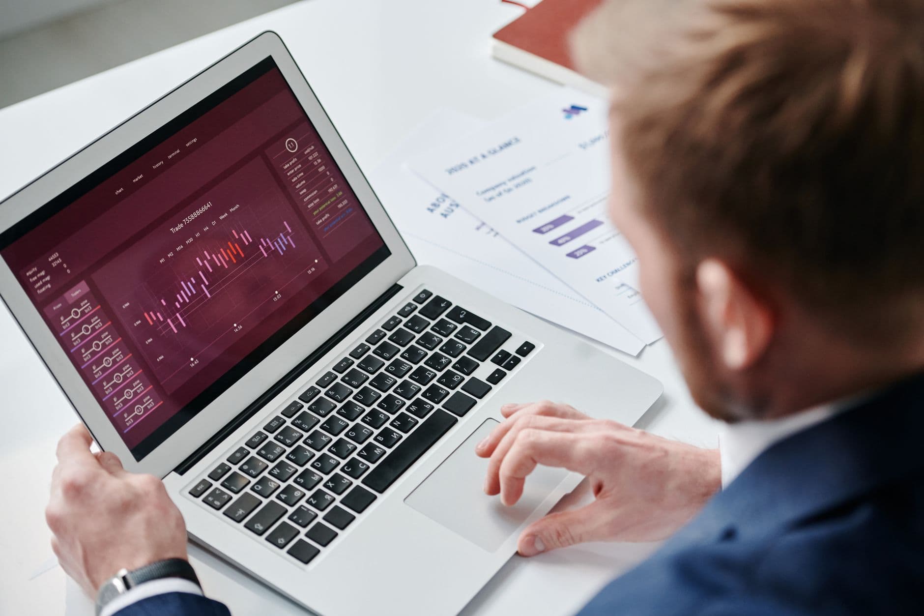 Laptop screen showing property portfolio financial reports and dashboards