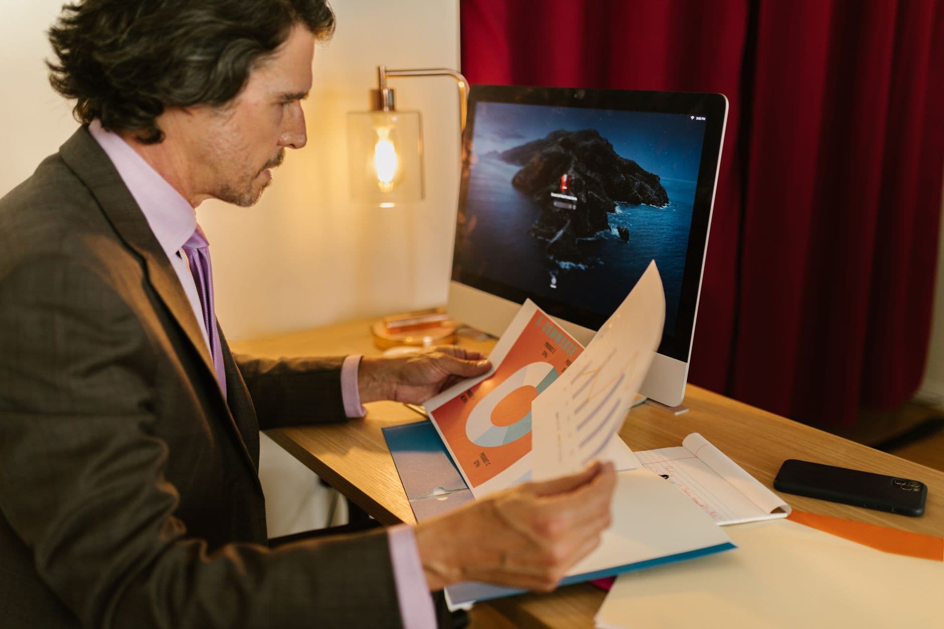Business owner reviewing multi-channel sales reports on a laptop