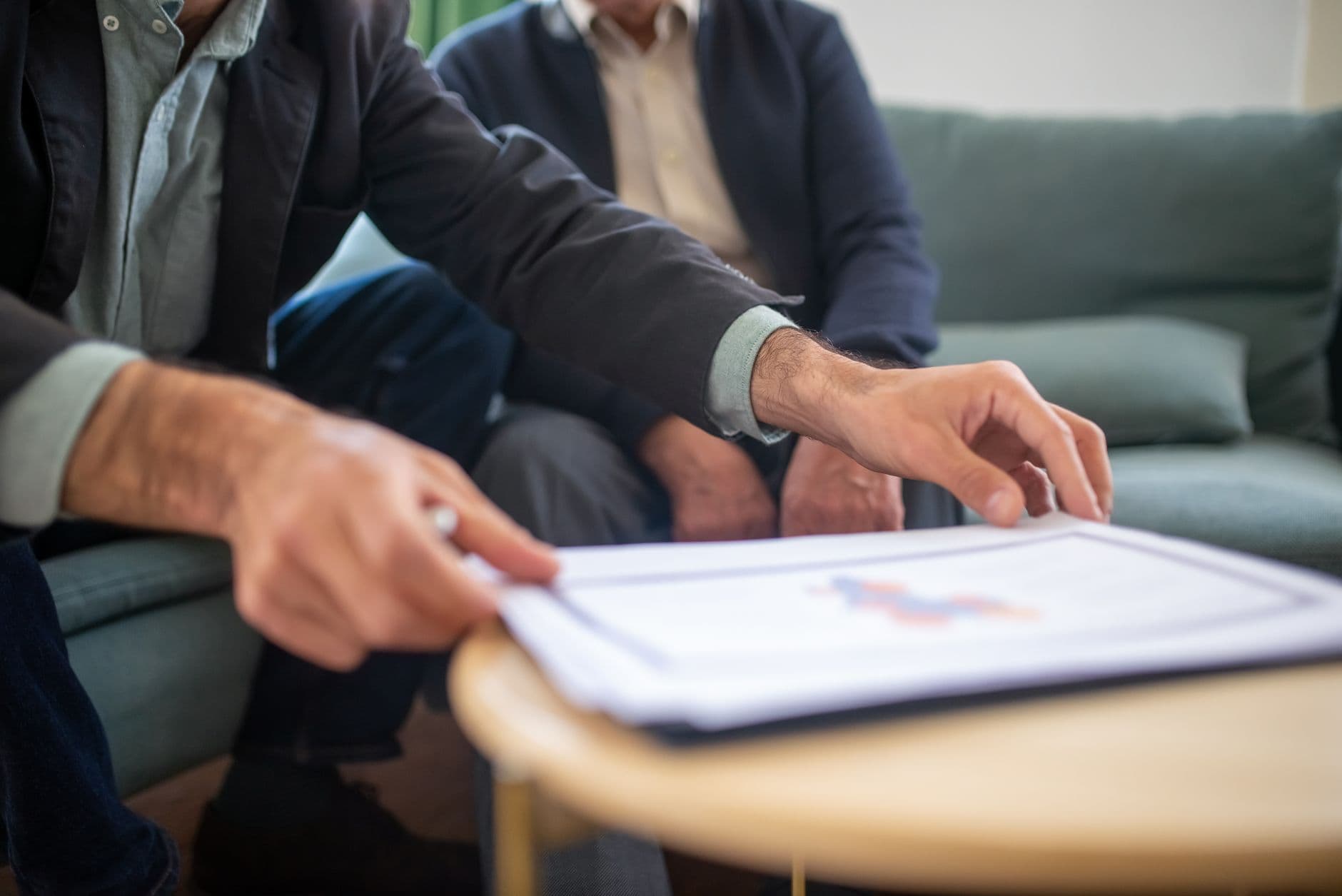 Advisor and client reviewing a signed service agreement together