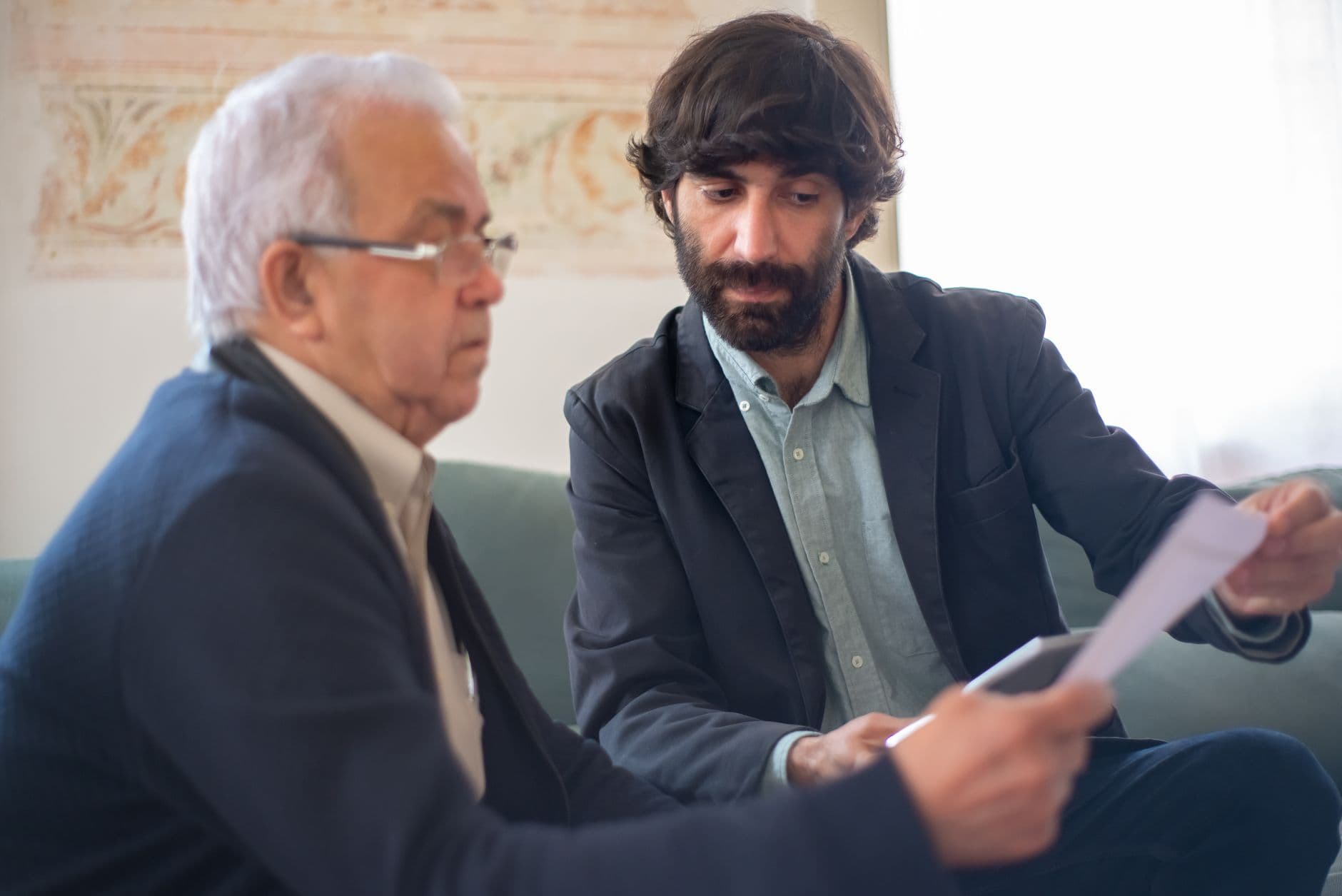 Accountant and small business owner reviewing financial reports together at a desk