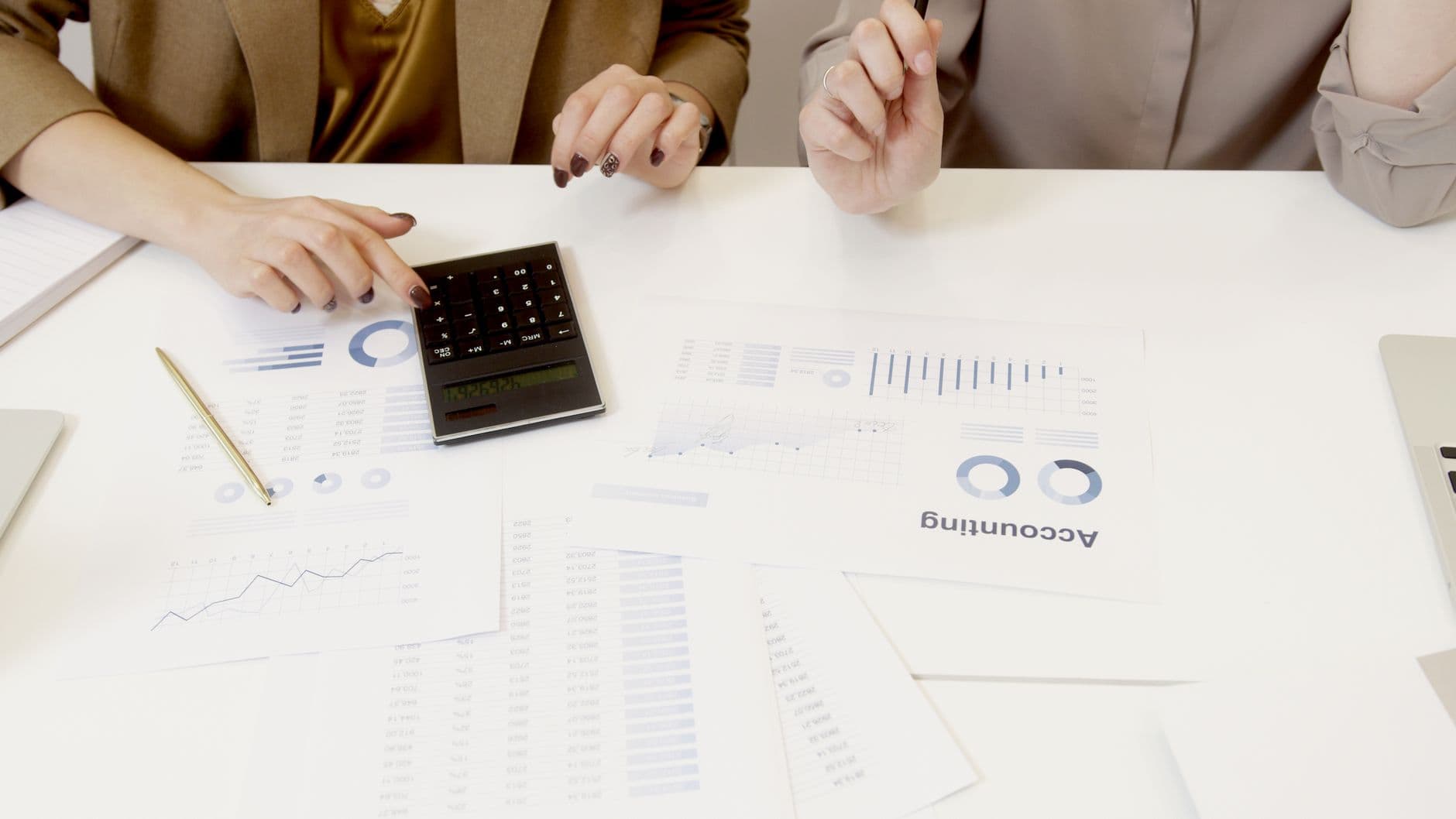 Accountant comparing sales data from multiple online marketplaces