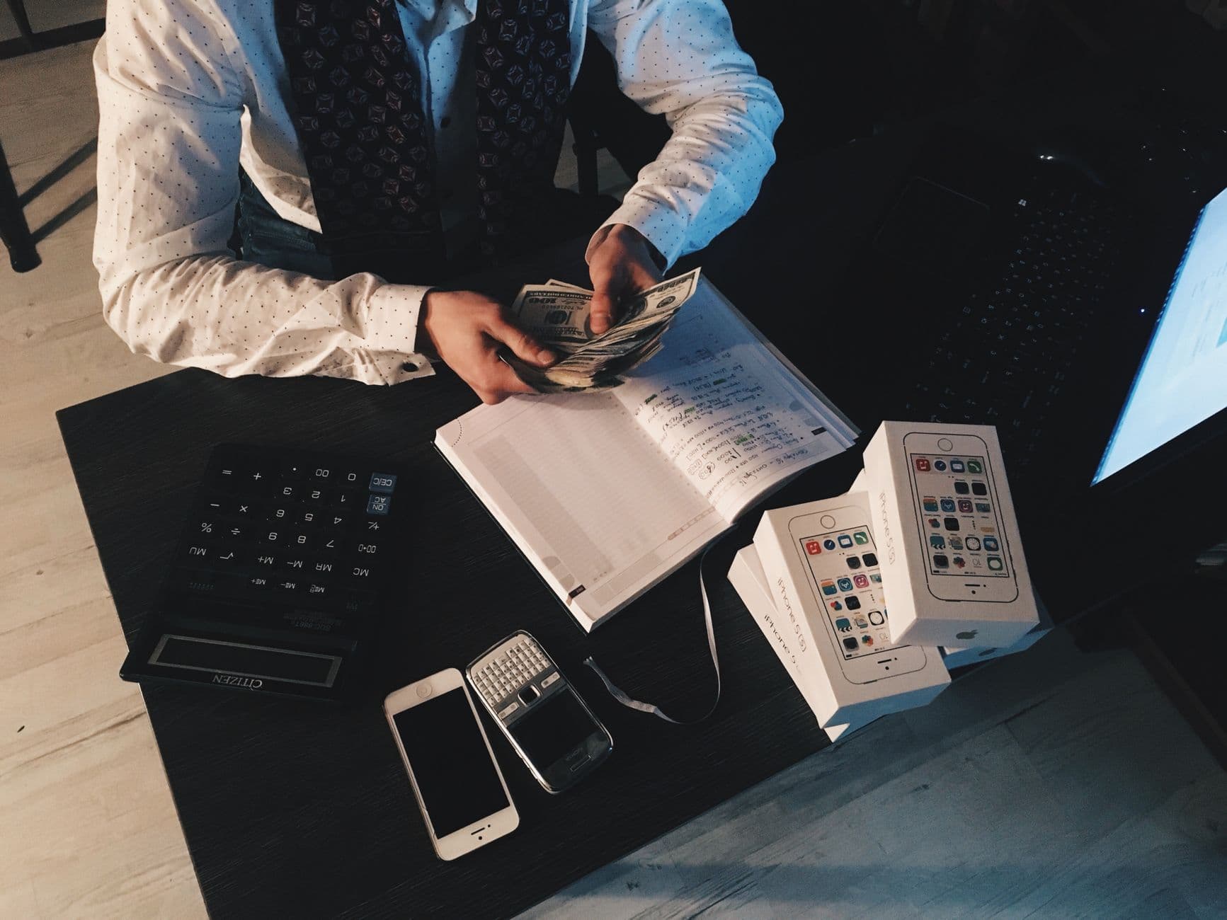 Small business owner and CPA reviewing financial reports together at a desk