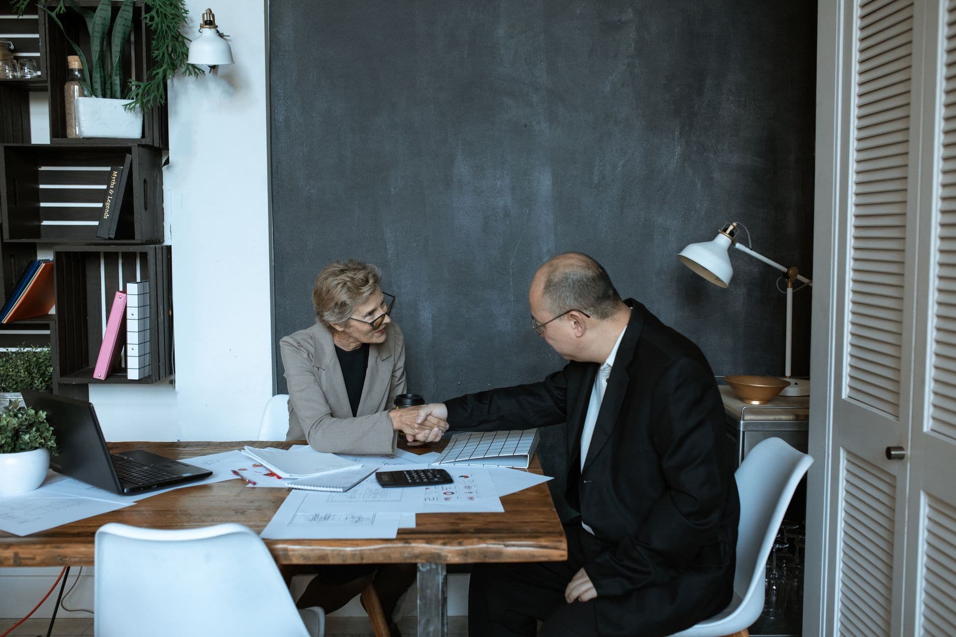 CPA and small business owner reviewing tax documents together