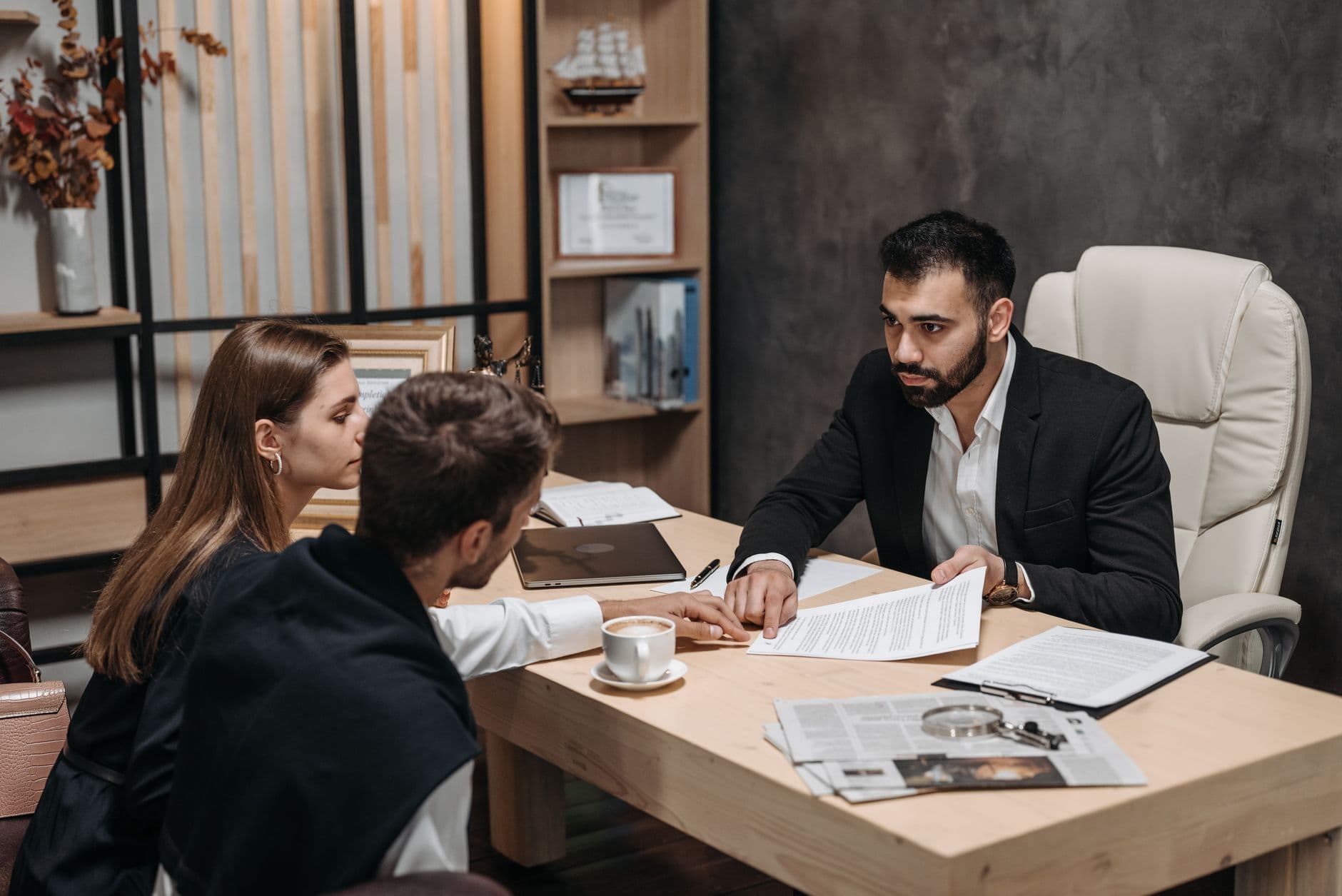 CPA explaining tax strategy documents to a client across a desk